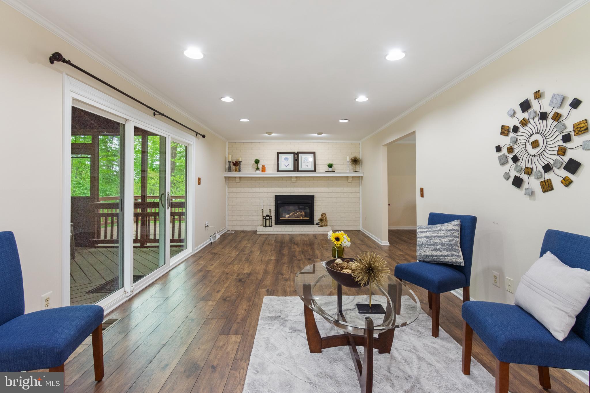 4036 Roop Road New Windsor, MD 21776 - Photo 13 of 55 a living room with furniture and a fireplace