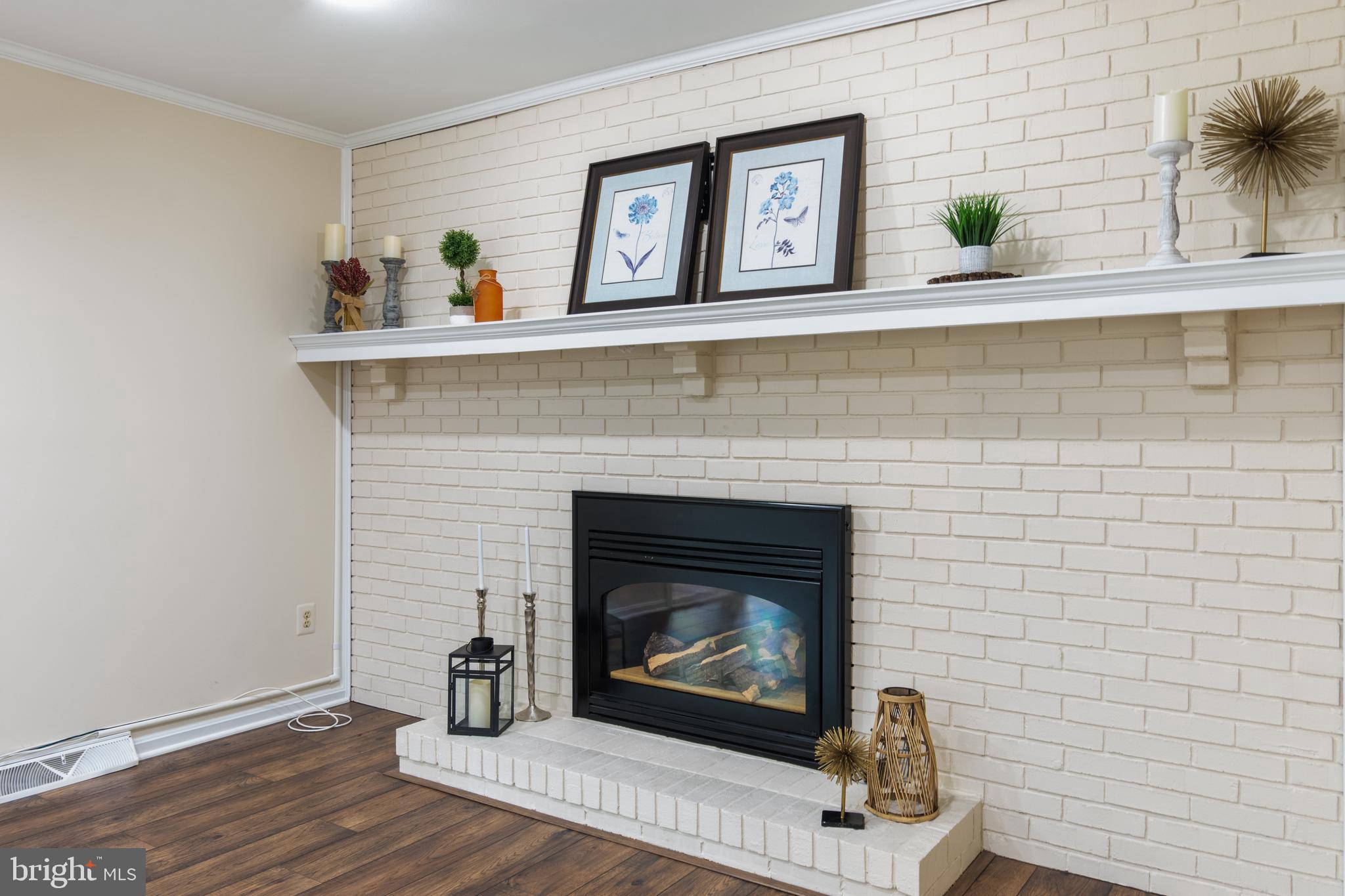 4036 Roop Road New Windsor, MD 21776 - Photo 14 of 55 a living room with furniture and a fireplace