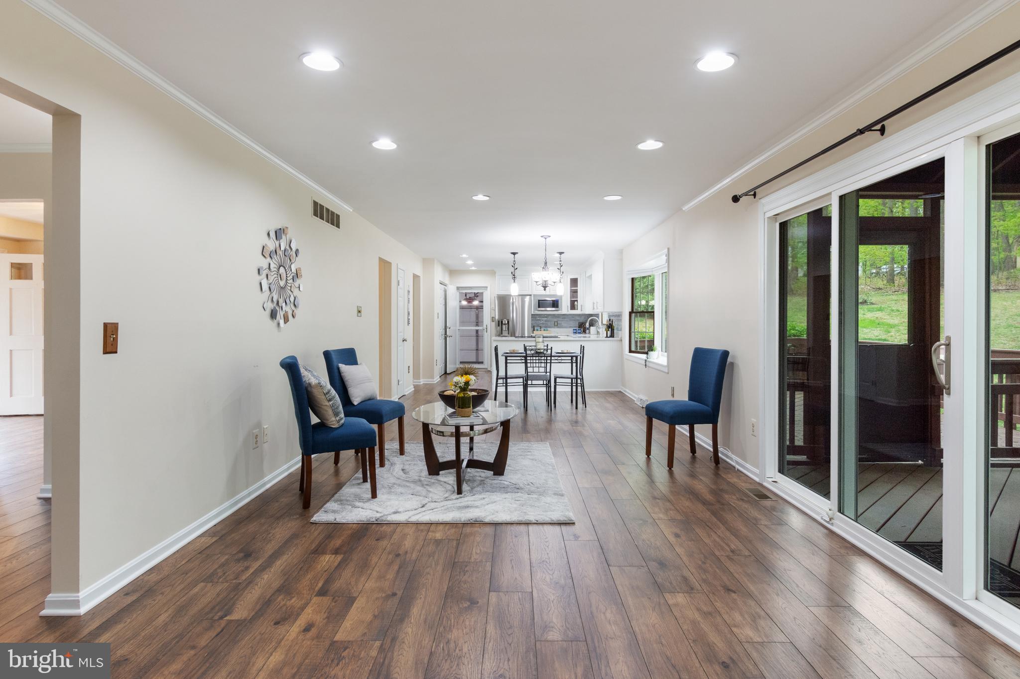 4036 Roop Road New Windsor, MD 21776 - Photo 15 of 55 a view of a dining room with furniture and wooden floor