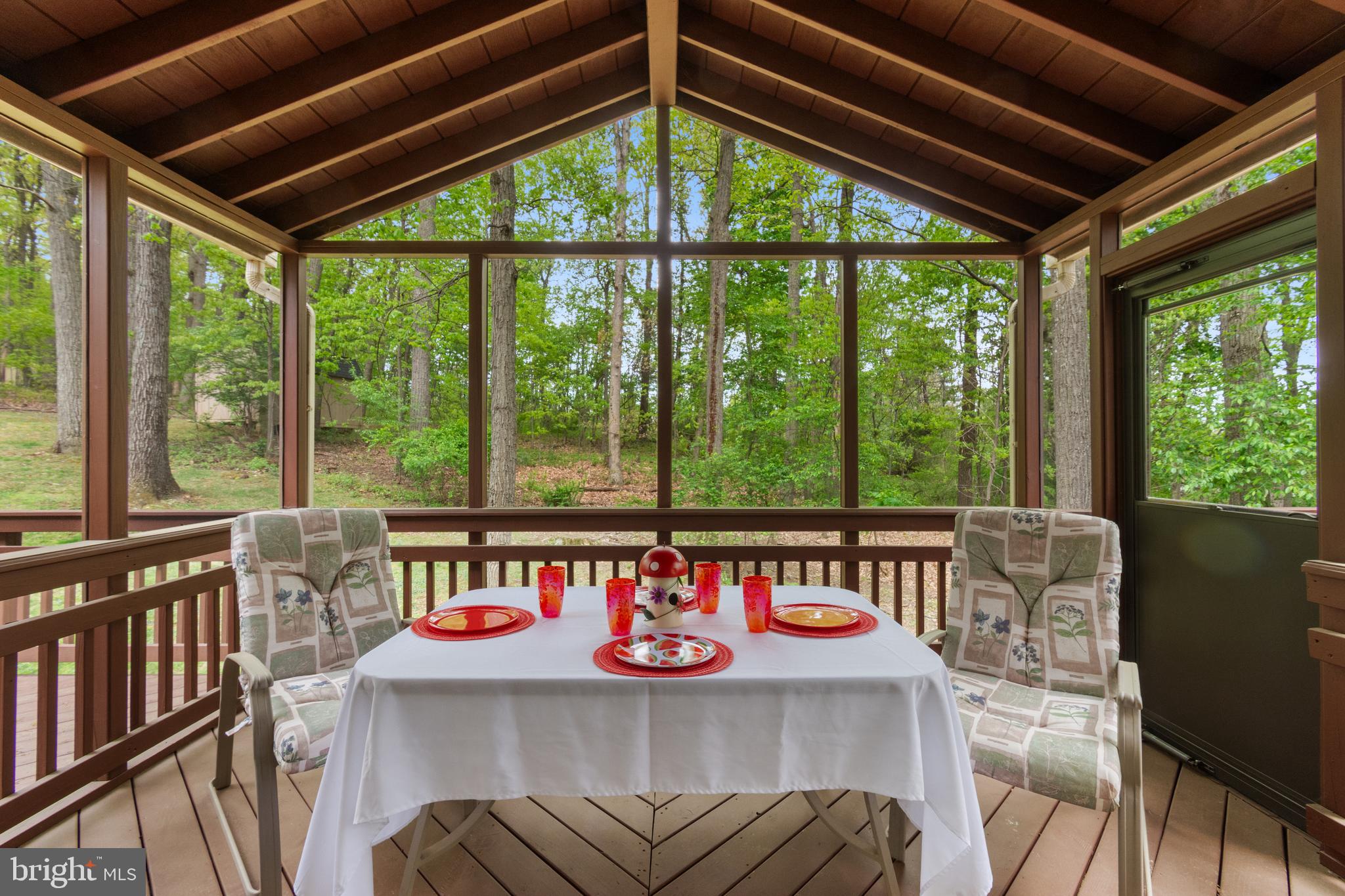 4036 Roop Road New Windsor, MD 21776 - Photo 16 of 55 a view of an outdoor dining space with furniture