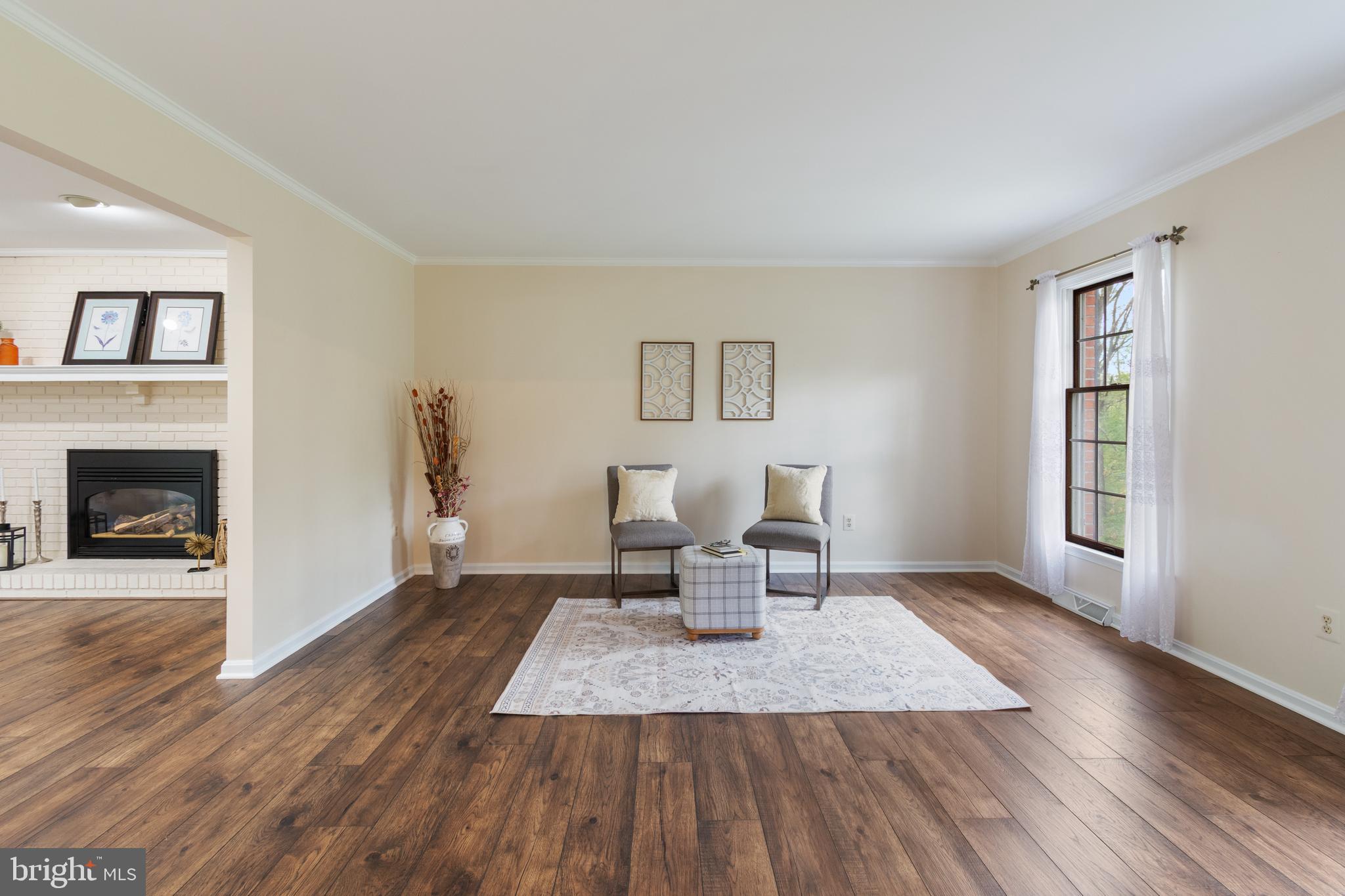 4036 Roop Road New Windsor, MD 21776 - Photo 18 of 55 a living room with furniture and a fireplace