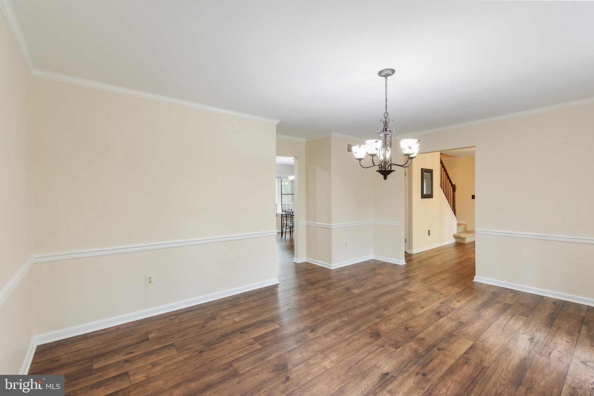 4036 Roop Road New Windsor, MD 21776 - Photo 21 of 55 a view of a room with wooden floor chandelier and entryway