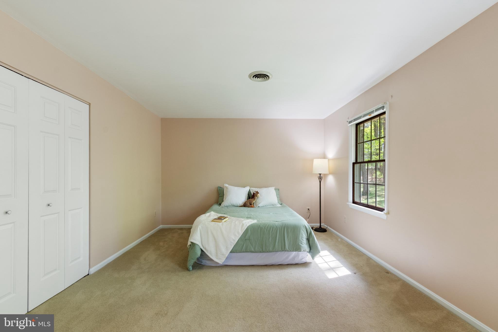 4036 Roop Road New Windsor, MD 21776 - Photo 35 of 55 a bedroom with a bed and a window