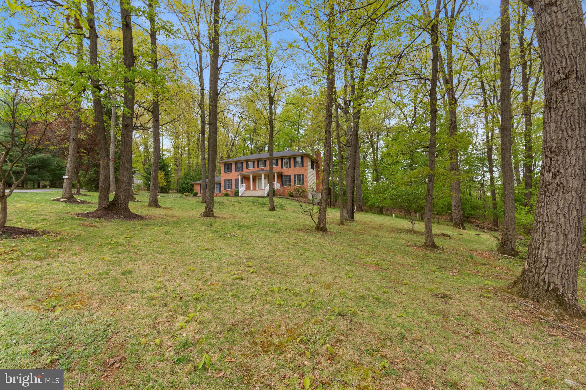 4036 Roop Road New Windsor, MD 21776 - Photo 5 of 55 a backyard of a house with lots of green space and fountain