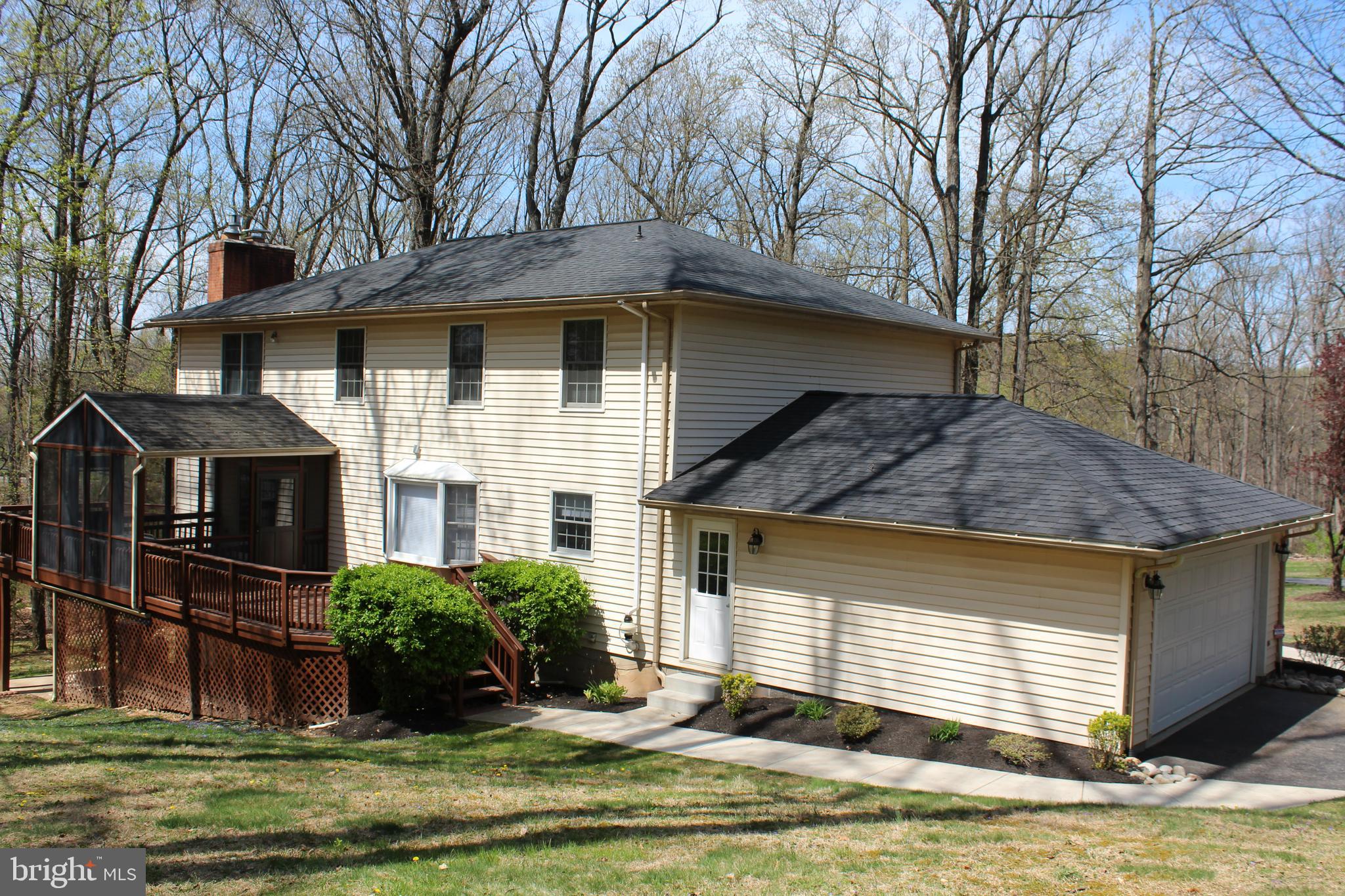 4036 Roop Road New Windsor, MD 21776 - Photo 6 of 55 a front view of a house with a yard
