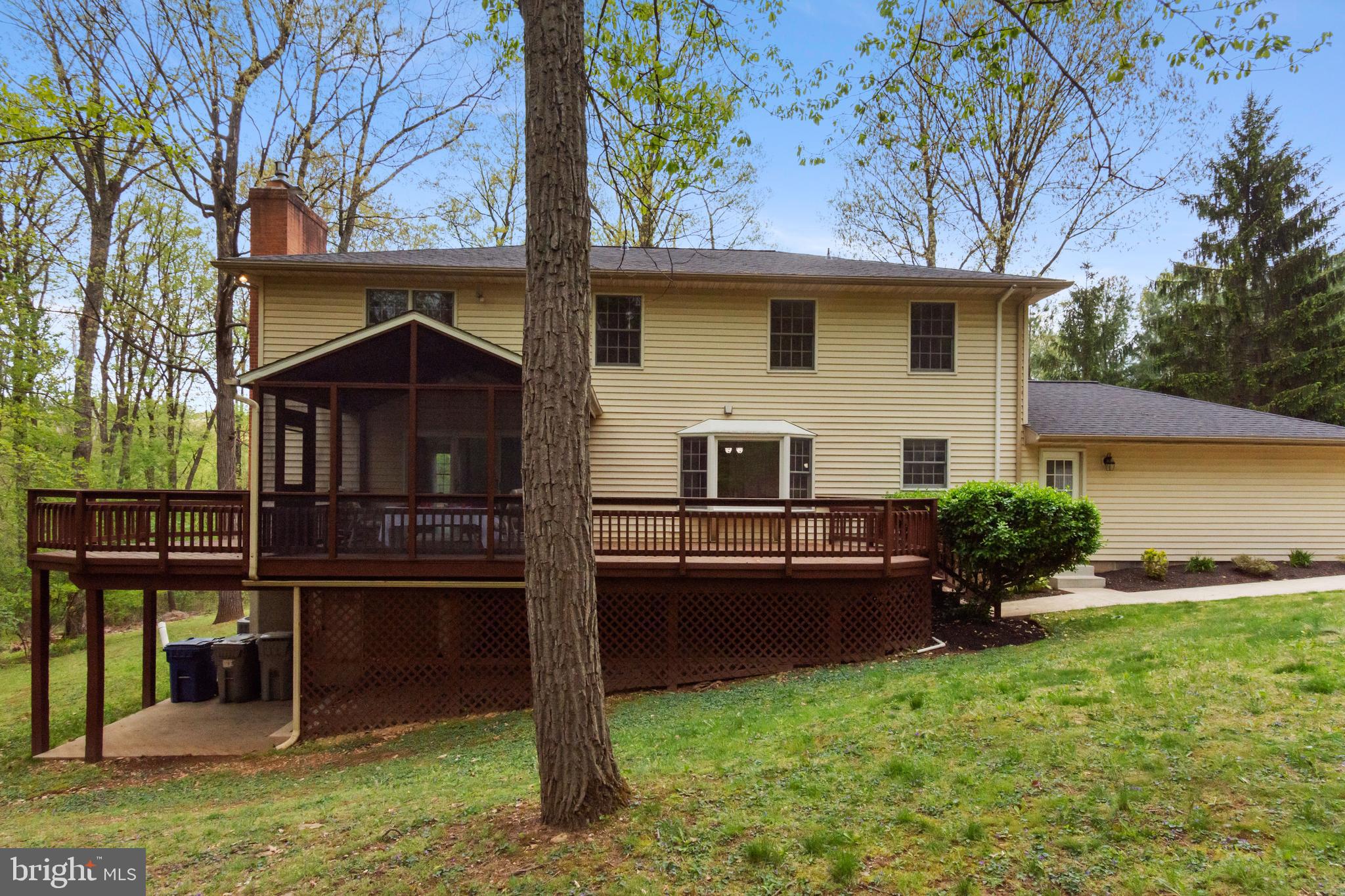 4036 Roop Road New Windsor, MD 21776 - Photo 7 of 55 a backyard of a house with barbeque oven