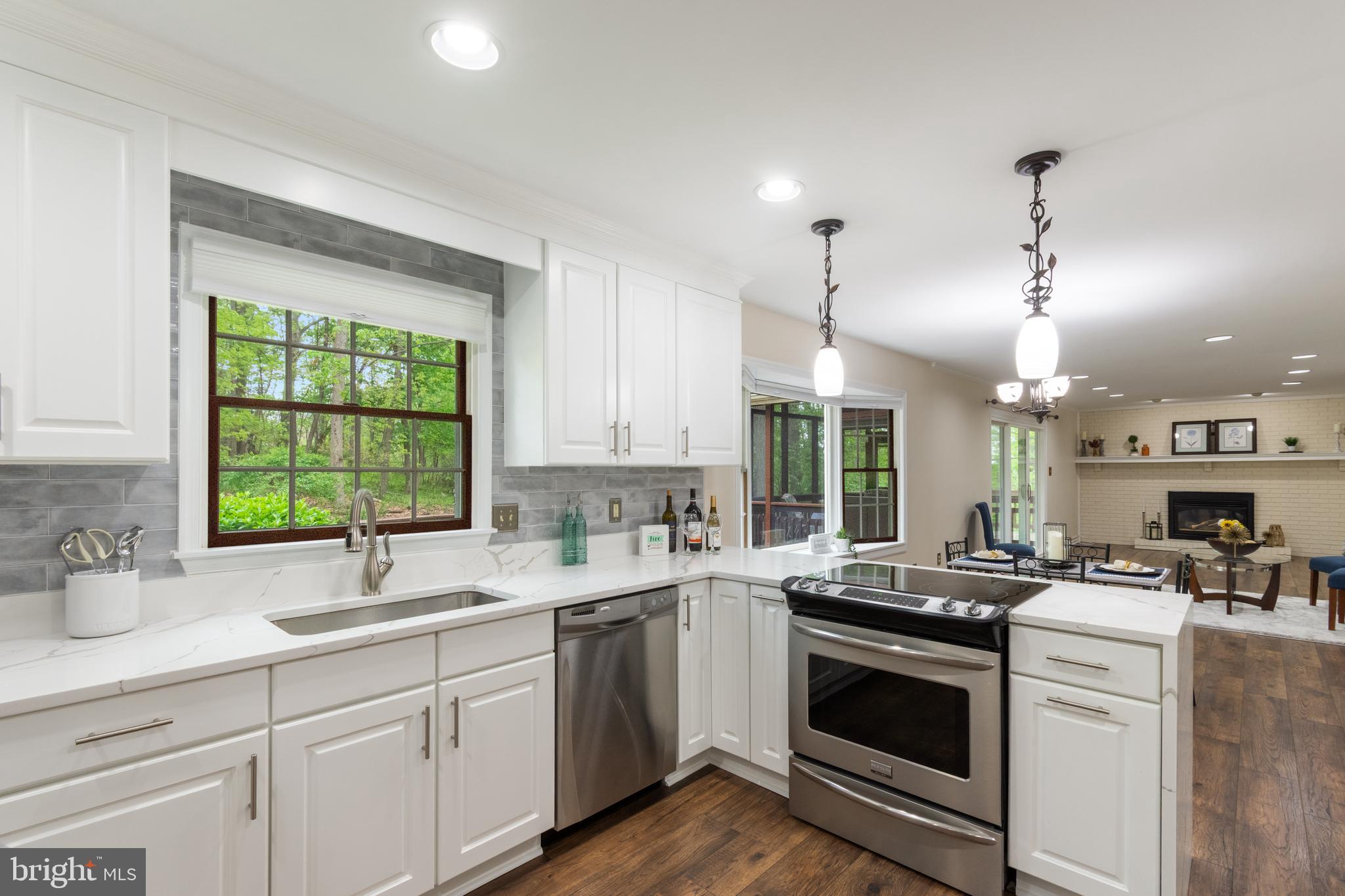 4036 Roop Road New Windsor, MD 21776 - Photo 10 of 55 a kitchen with a sink stove and cabinets