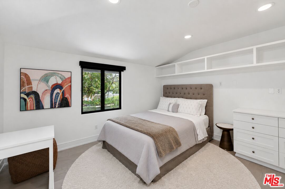 760 South San Rafael Avenue Pasadena, CA 91105 - Photo 37 of 45 a bedroom with a bed and a window