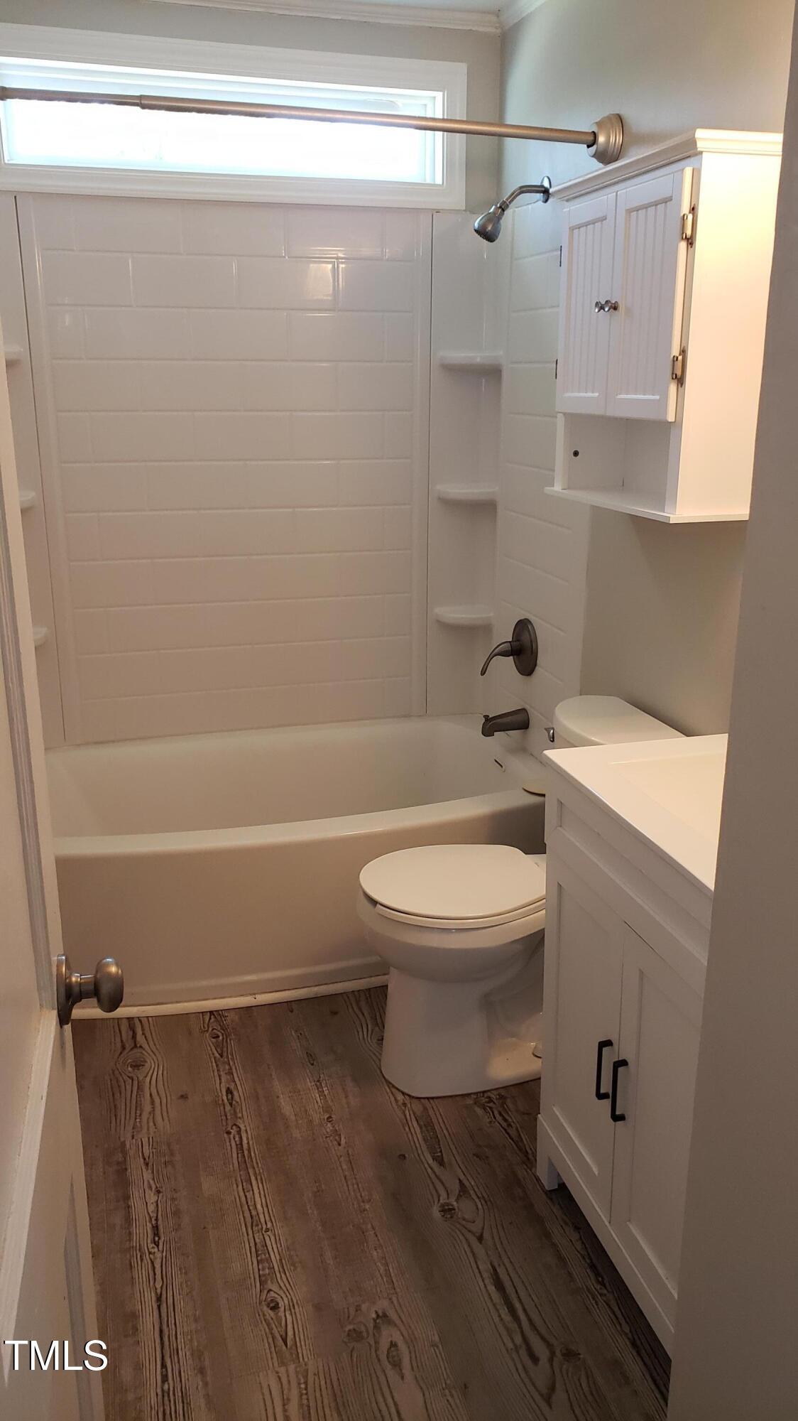 2739 Layden Street Raleigh, NC 27603 - Photo 7 of 10 a bathroom with a toilet and a shower