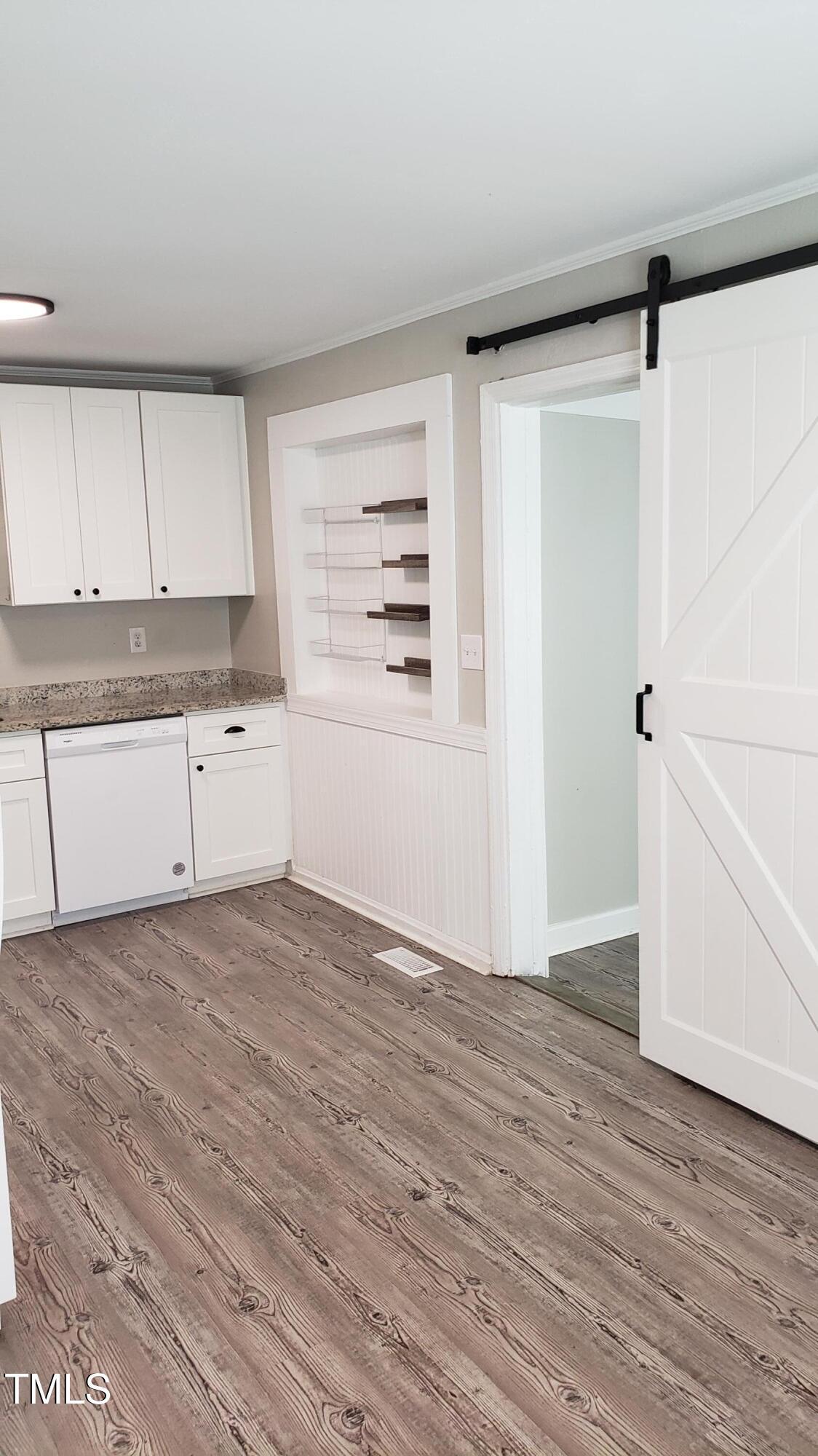 2739 Layden Street Raleigh, NC 27603 - Photo 9 of 10 wooden floor in an empty room with a window
