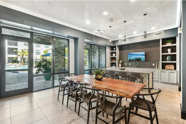 a dining room with furniture and wooden floor