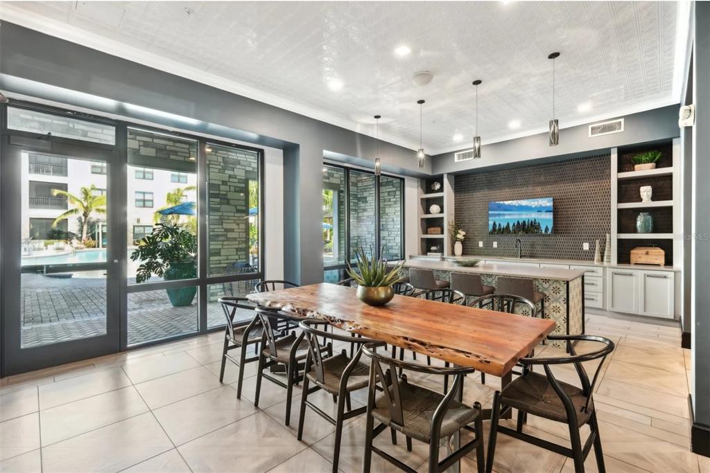 2201 Northwest Federal Highway, Unit 2B1314 Stuart, FL 34994 - Photo 24 of 47 a dining room with furniture and wooden floor