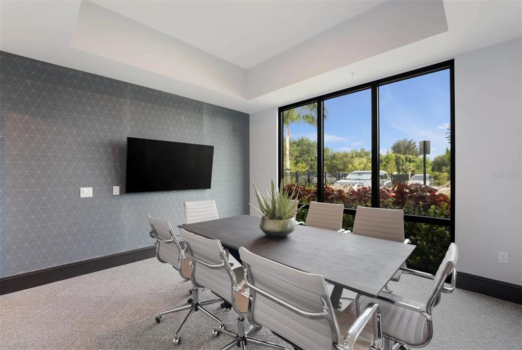 2201 Northwest Federal Highway, Unit 2B1314 Stuart, FL 34994 - Photo 27 of 47 a view of a livingroom with furniture and a flat screen tv