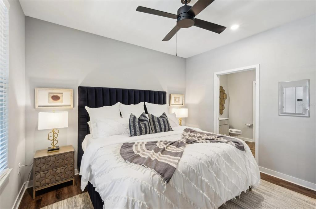 2201 Northwest Federal Highway, Unit 2B1314 Stuart, FL 34994 - Photo 8 of 47 a bedroom with a bed and wooden floor