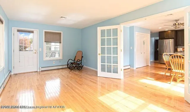 a view of a livingroom with furniture and a window