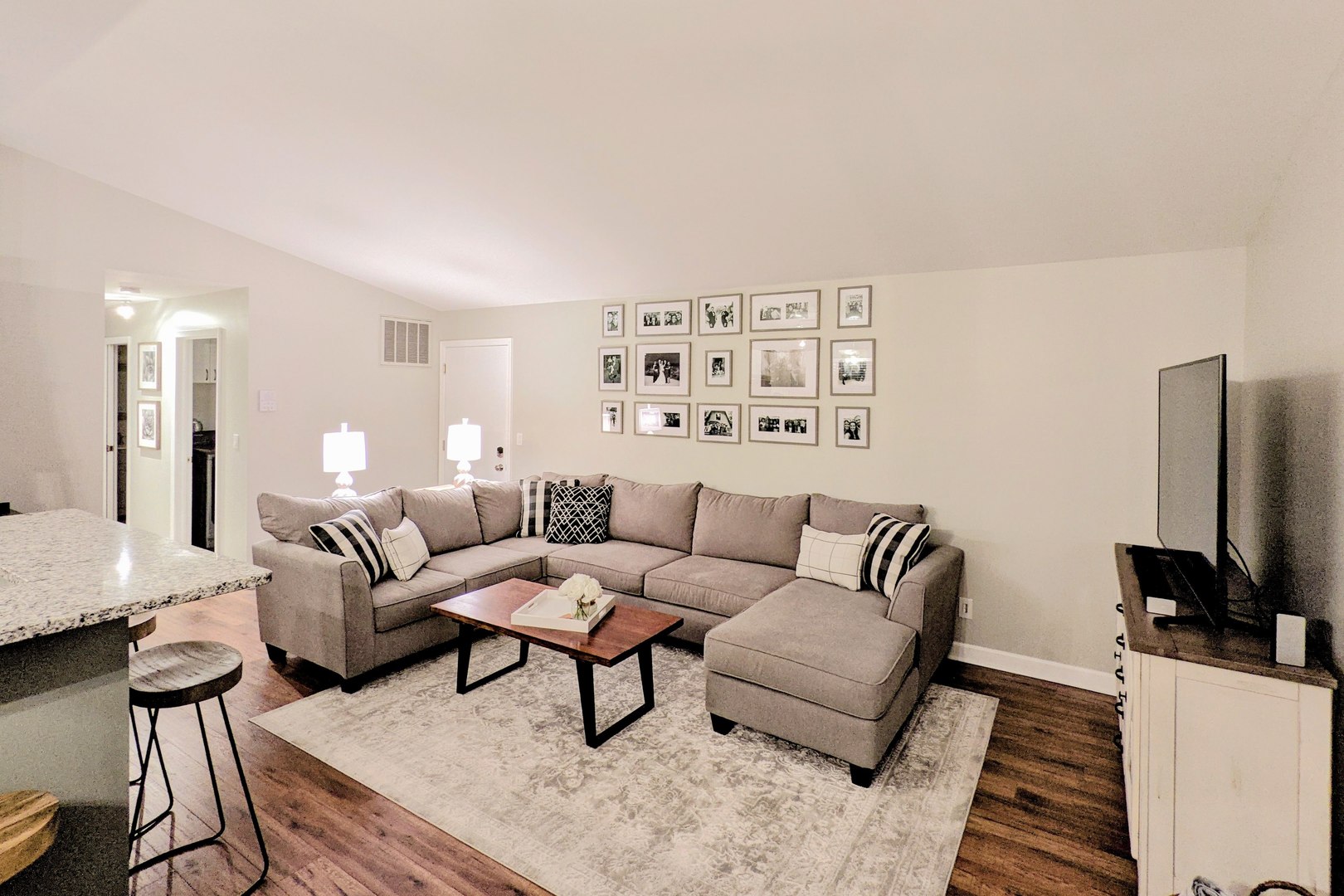 140 West Golf Road, Unit B Libertyville, IL 60048 - Photo 8 of 14 a living room with furniture and a flat screen tv