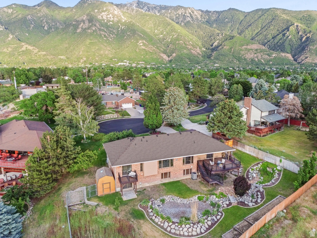 2342 Charros Road Sandy, UT 84092 - Photo 82 of 94 Expansive rear elevation featuring a brick exterior and a multi-level deck