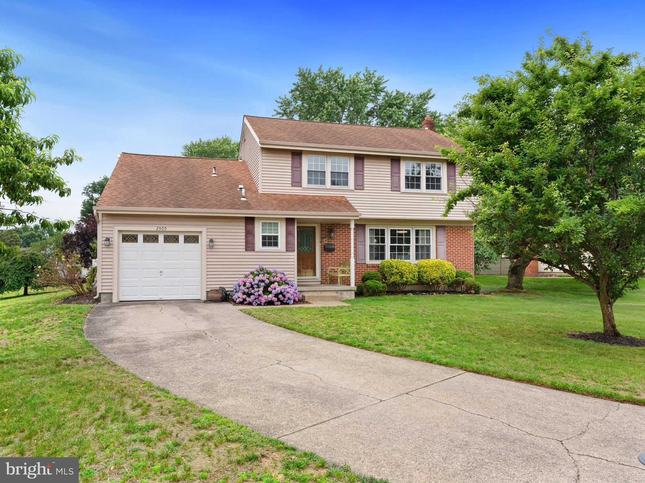 2505 Yellowstone Road Cinnaminson, NJ 08077 - Photo 1 of 40 a front view of a house with a garden and yard