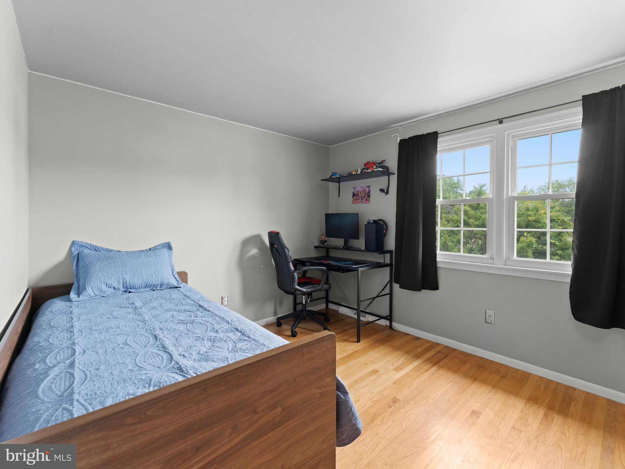 2505 Yellowstone Road Cinnaminson, NJ 08077 - Photo 12 of 40 a bedroom with a bed a desk and chair with window