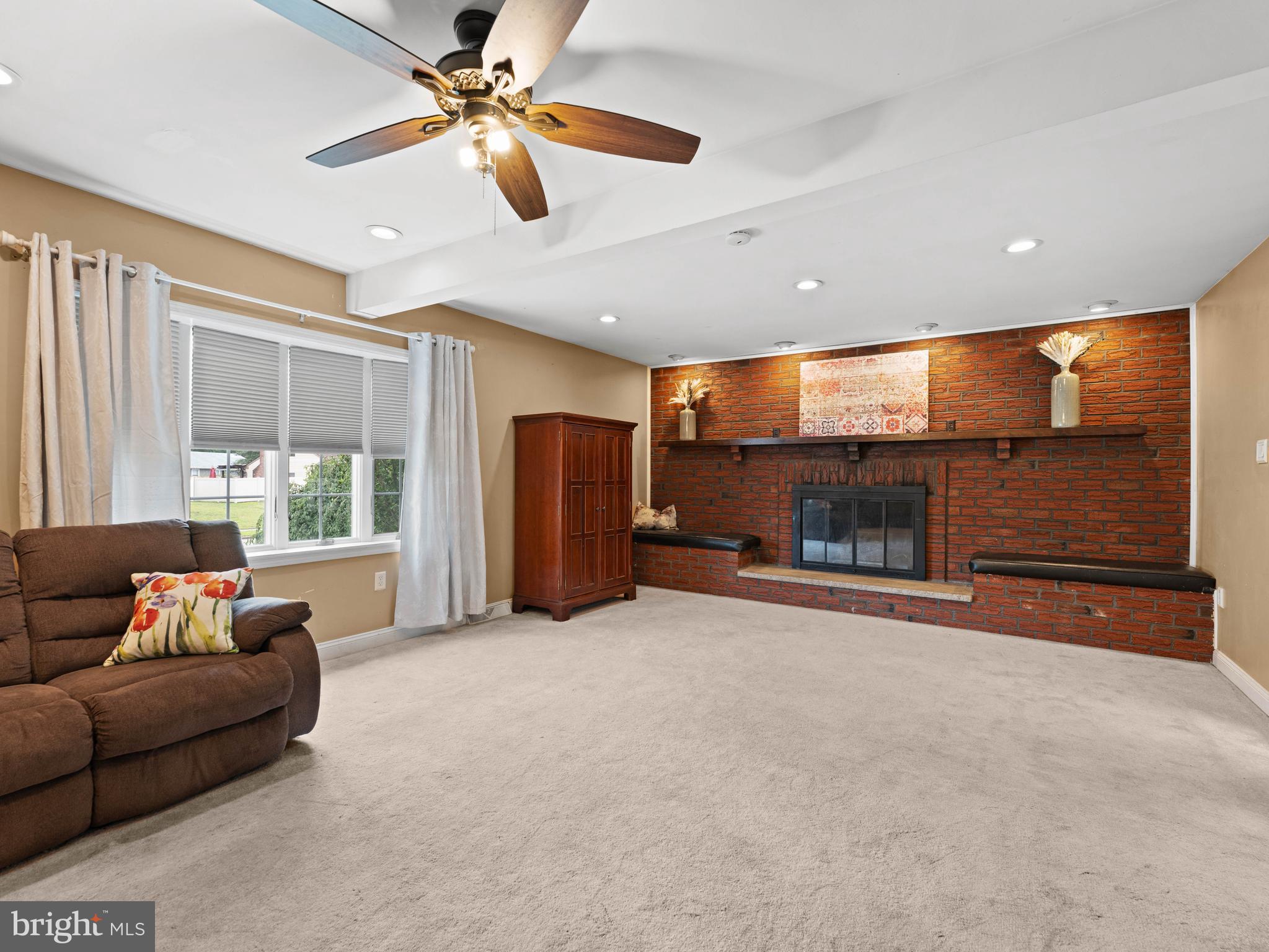 2505 Yellowstone Road Cinnaminson, NJ 08077 - Photo 21 of 40 a living room with furniture and a fireplace