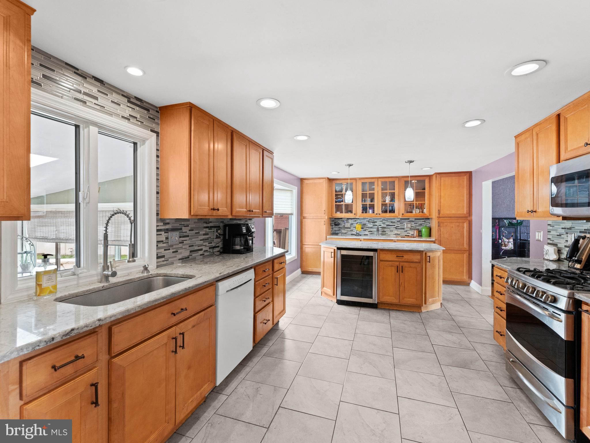 2505 Yellowstone Road Cinnaminson, NJ 08077 - Photo 22 of 40 a kitchen with stainless steel appliances granite countertop a stove a sink and a refrigerator