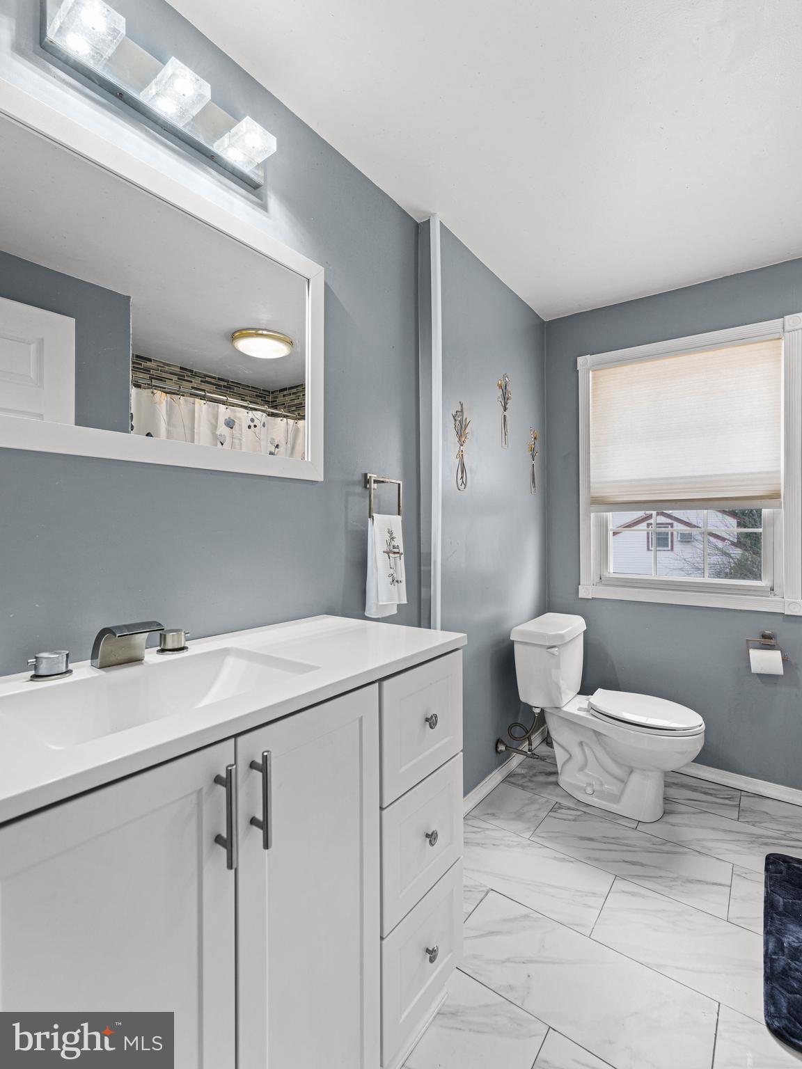 2505 Yellowstone Road Cinnaminson, NJ 08077 - Photo 9 of 40 a bathroom with a sink toilet and window