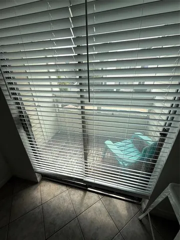 a view of a window with wooden floor