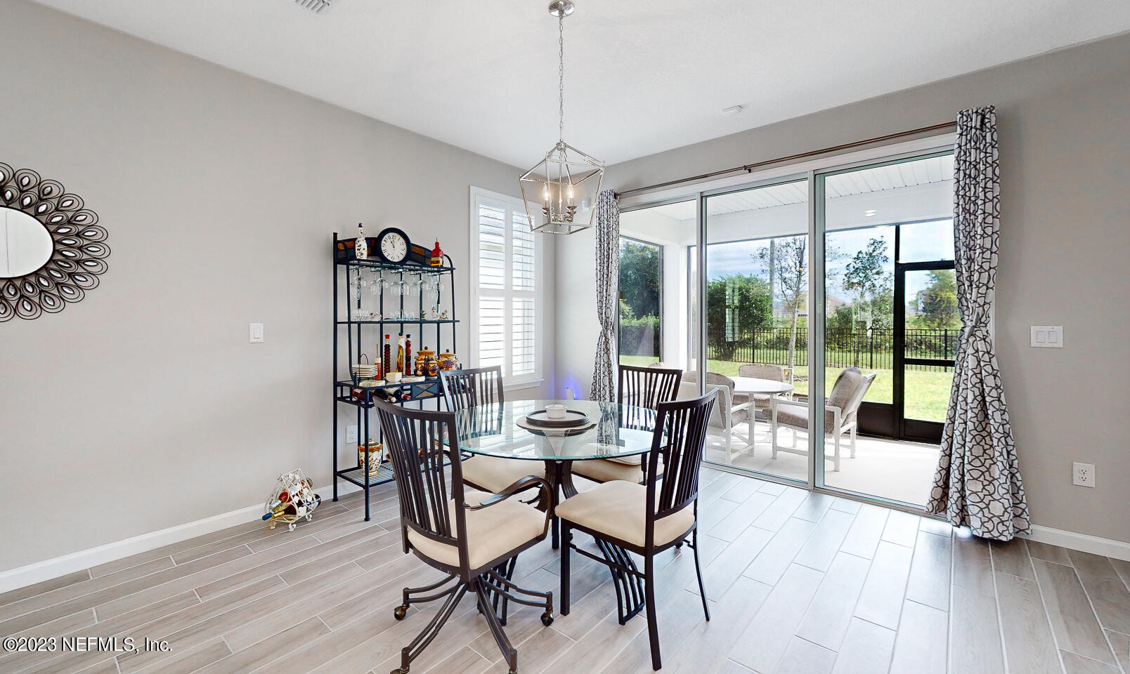 1113 Rustic Ml Drive St. Augustine, FL 32092 - Photo 12 of 62 a view of a dining room with furniture wooden floor and chandelier