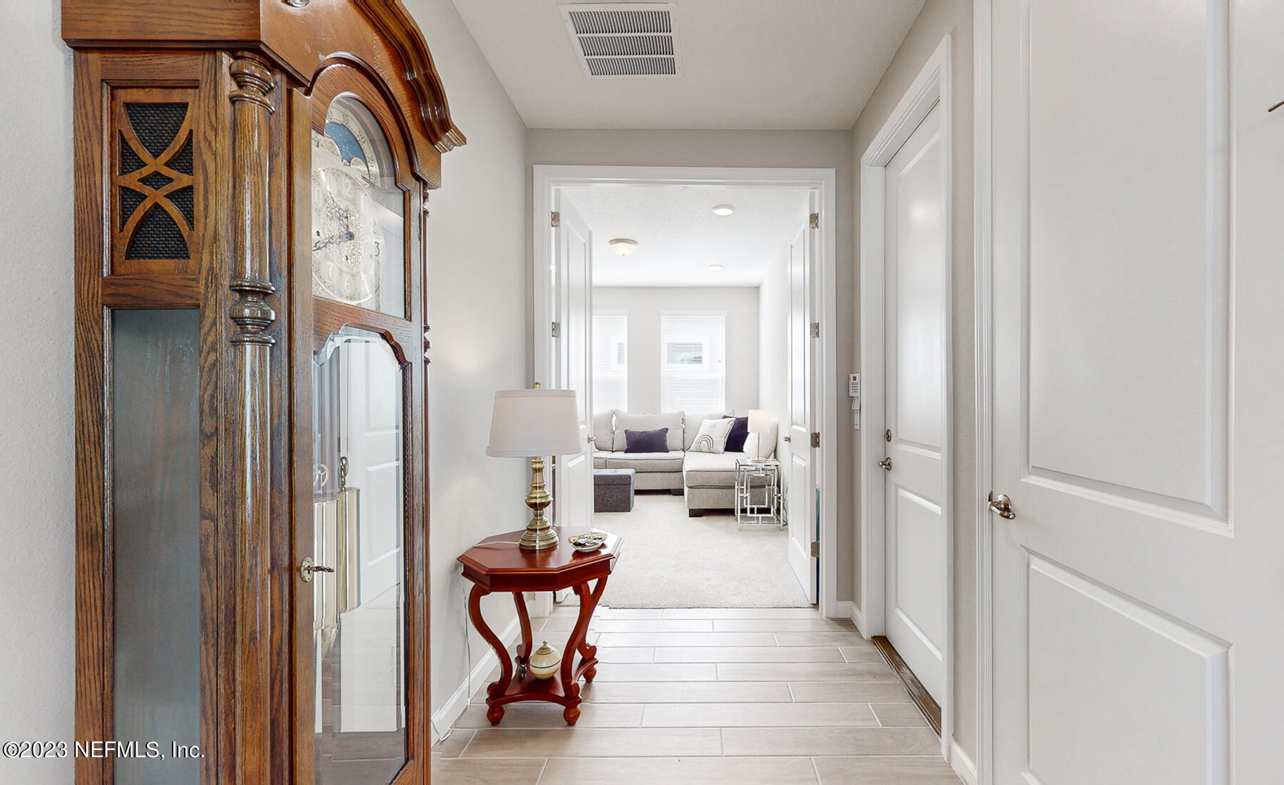 1113 Rustic Ml Drive St. Augustine, FL 32092 - Photo 13 of 62 a living room with furniture and a painting on the wall