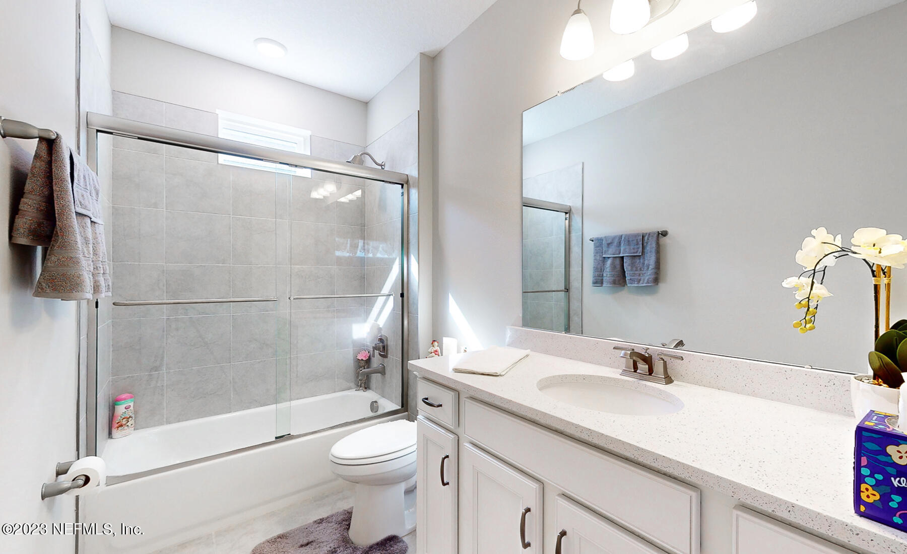 1113 Rustic Ml Drive St. Augustine, FL 32092 - Photo 18 of 62 a bathroom with a granite countertop sink toilet and shower