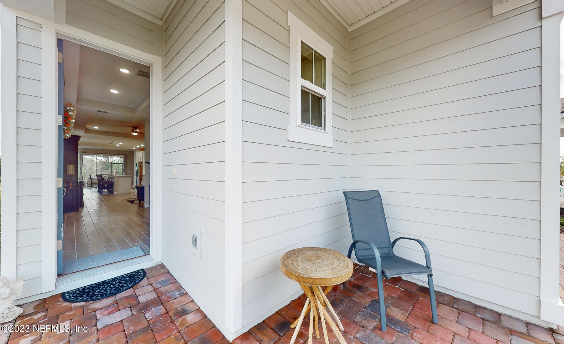 1113 Rustic Ml Drive St. Augustine, FL 32092 - Photo 2 of 62 a view of a door and chair in a patio