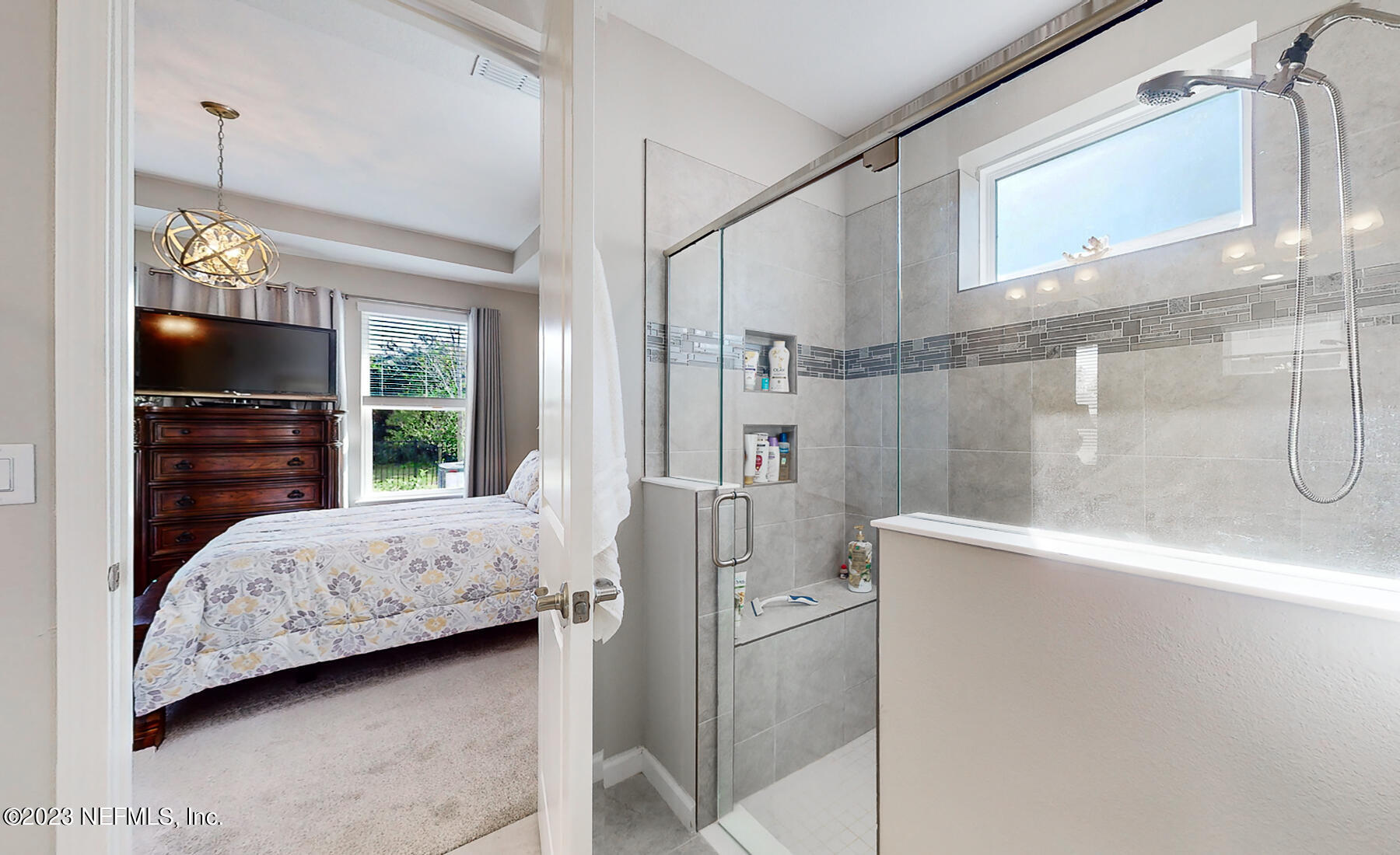 1113 Rustic Ml Drive St. Augustine, FL 32092 - Photo 22 of 62 a bedroom with a bed and a walk in closet