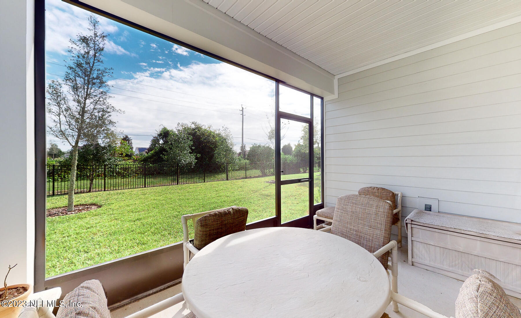 1113 Rustic Ml Drive St. Augustine, FL 32092 - Photo 26 of 62 a view of a porch with furniture and a yard