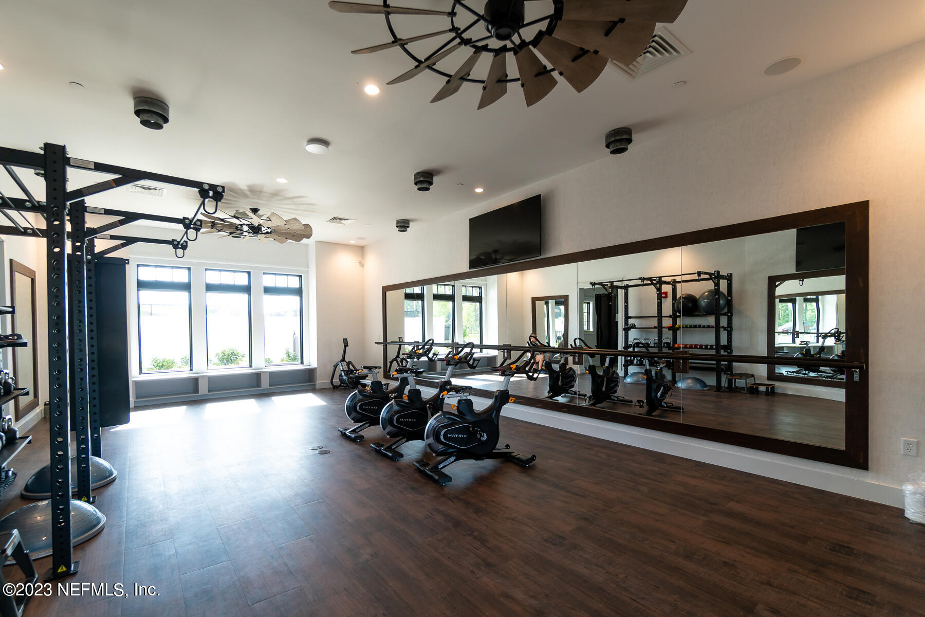 1113 Rustic Ml Drive St. Augustine, FL 32092 - Photo 43 of 62 a living room with furniture gym equipment and a large window