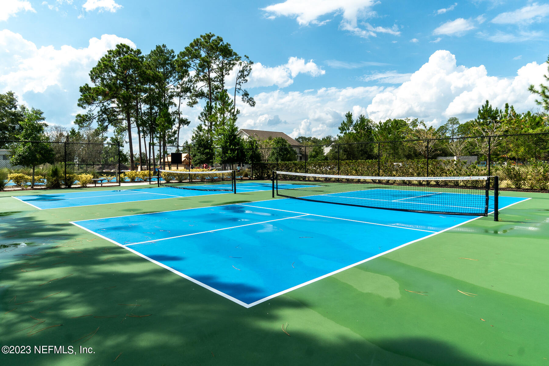 1113 Rustic Ml Drive St. Augustine, FL 32092 - Photo 47 of 62 a view of an outdoor space and tennis court