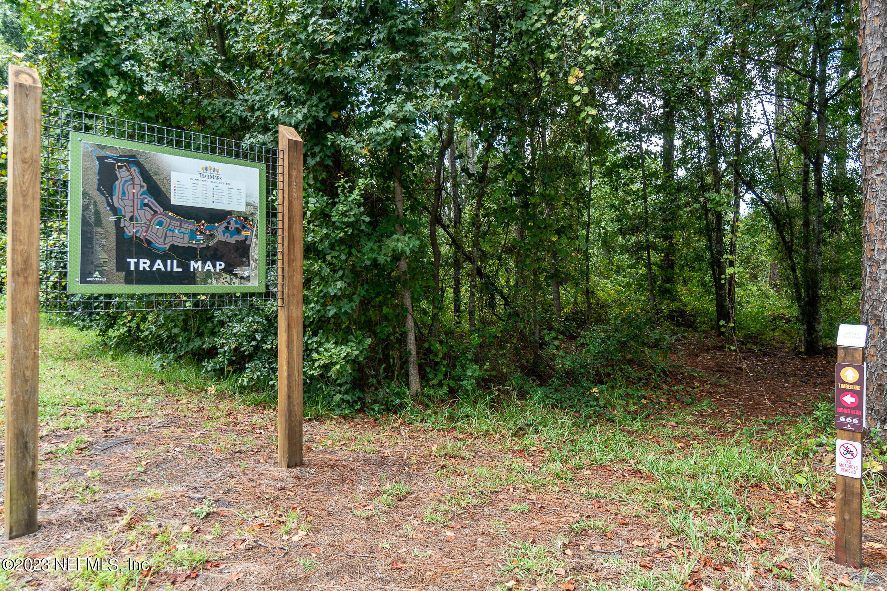 1113 Rustic Ml Drive St. Augustine, FL 32092 - Photo 52 of 62 a sign that is sitting in front of a tree
