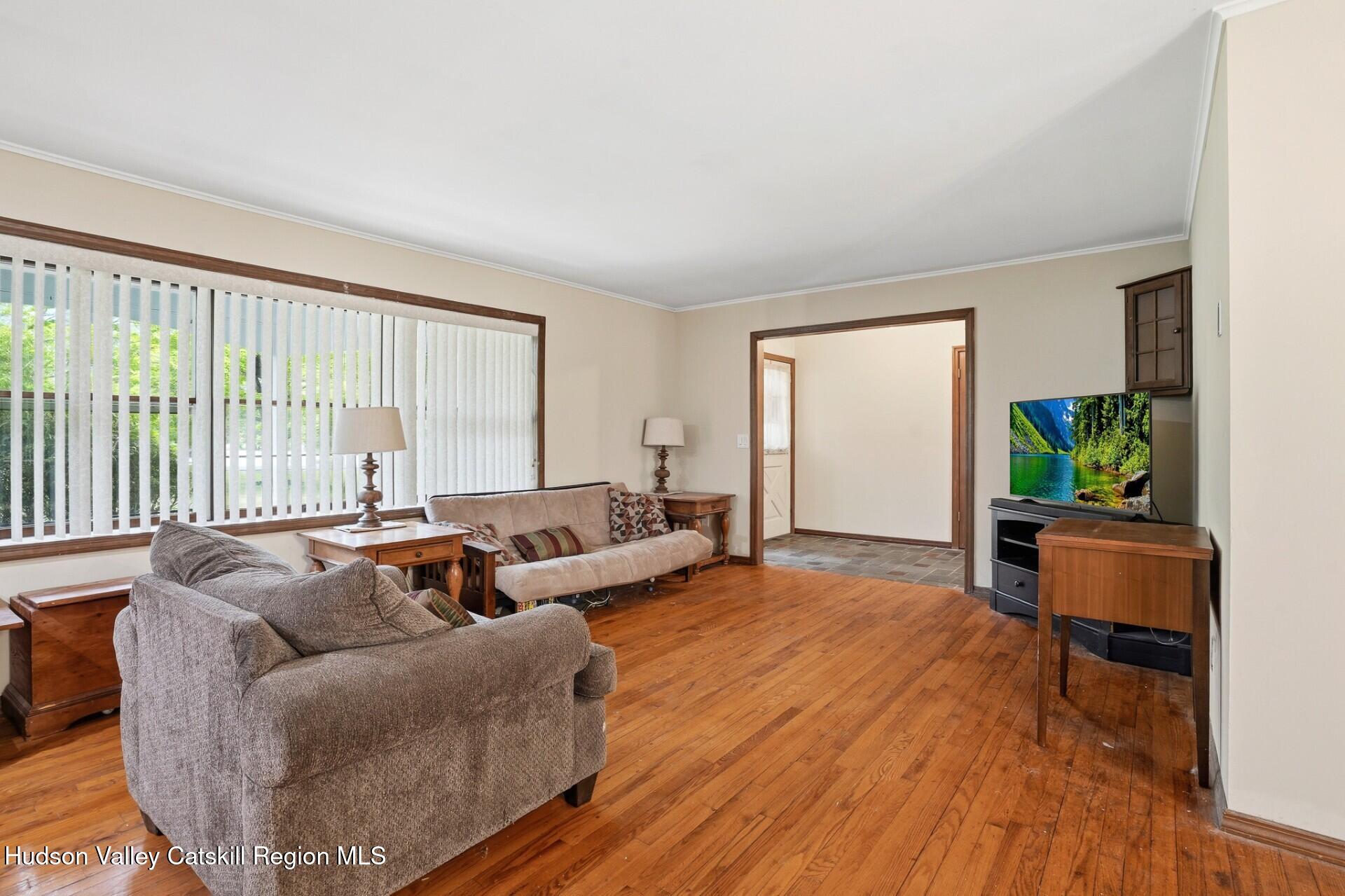 984 Blue Mountain Road Saugerties, NY 12477 - Photo 9 of 24 a living room with furniture and a large window