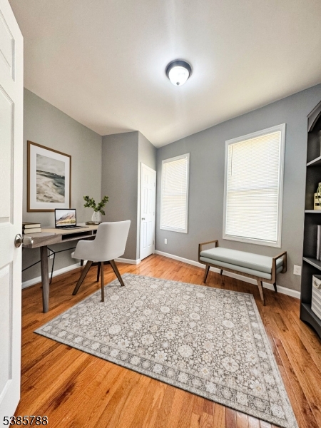 705 South 15th Street Newark, NJ 07103 - Photo 12 of 26 a living room with furniture a rug and a window