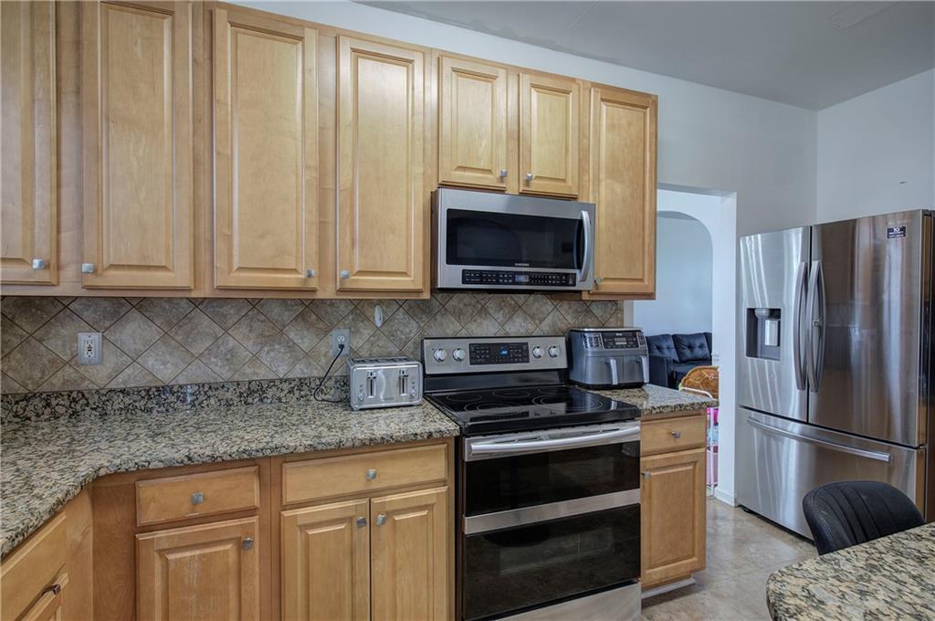 4508 Howell Farms Road Northwest Acworth, GA 30101 - Photo 14 of 42 a kitchen with a refrigerator stove and microwave