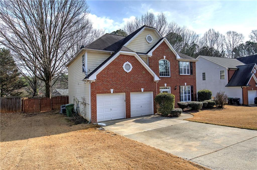 4508 Howell Farms Road Northwest Acworth, GA 30101 - Photo 2 of 42 a front view of a house with a yard and garage