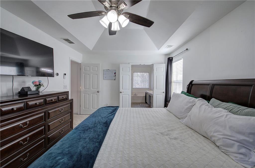 4508 Howell Farms Road Northwest Acworth, GA 30101 - Photo 21 of 42 a bedroom with a bed and wooden floor