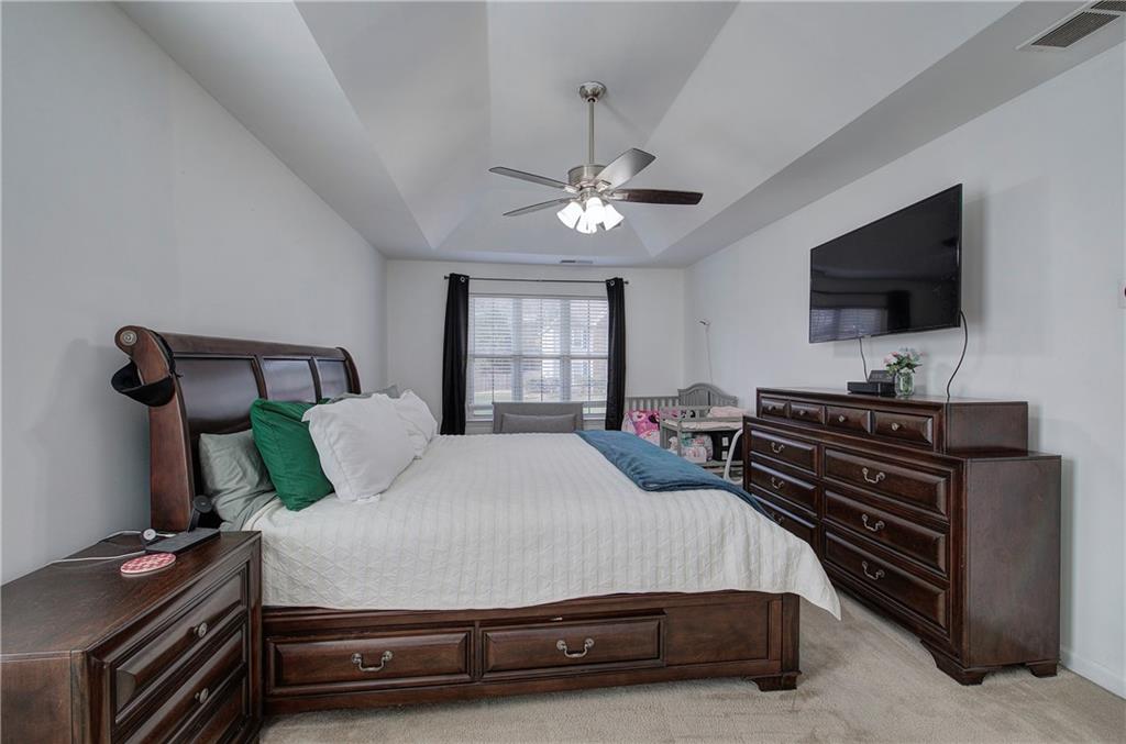4508 Howell Farms Road Northwest Acworth, GA 30101 - Photo 22 of 42 a bedroom with a bed and a flat screen tv