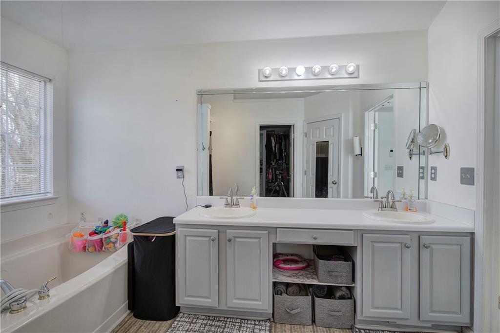 4508 Howell Farms Road Northwest Acworth, GA 30101 - Photo 24 of 42 a bathroom with a sink vanity and a mirror