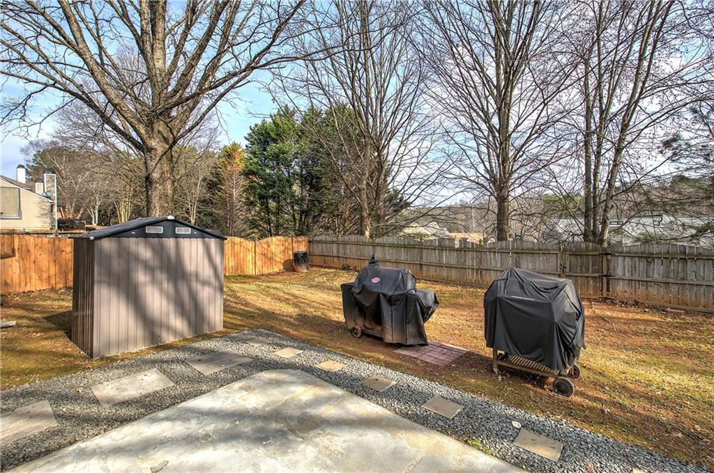 4508 Howell Farms Road Northwest Acworth, GA 30101 - Photo 34 of 42 a backyard of a house with table and chairs
