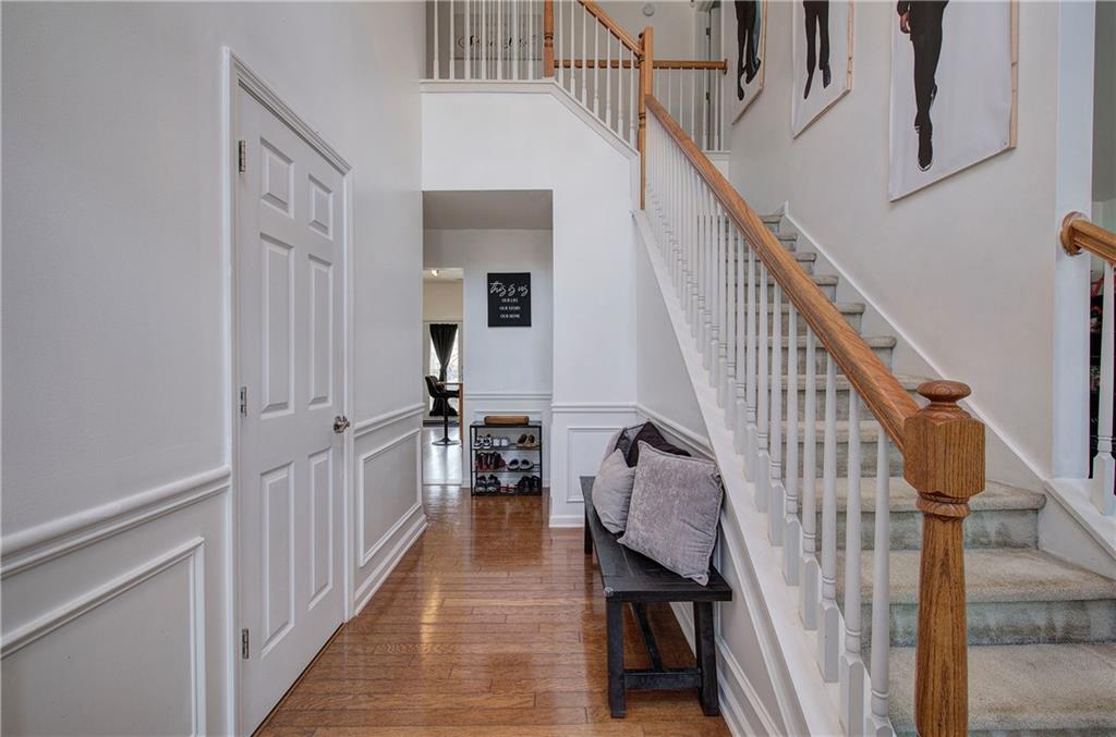 4508 Howell Farms Road Northwest Acworth, GA 30101 - Photo 4 of 42 a view of a hallway with wooden floor and staircase