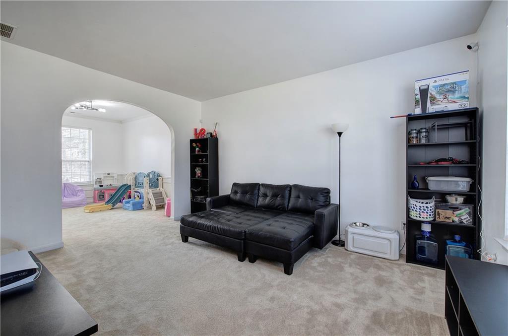 4508 Howell Farms Road Northwest Acworth, GA 30101 - Photo 7 of 42 a living room with furniture and a walk in closet