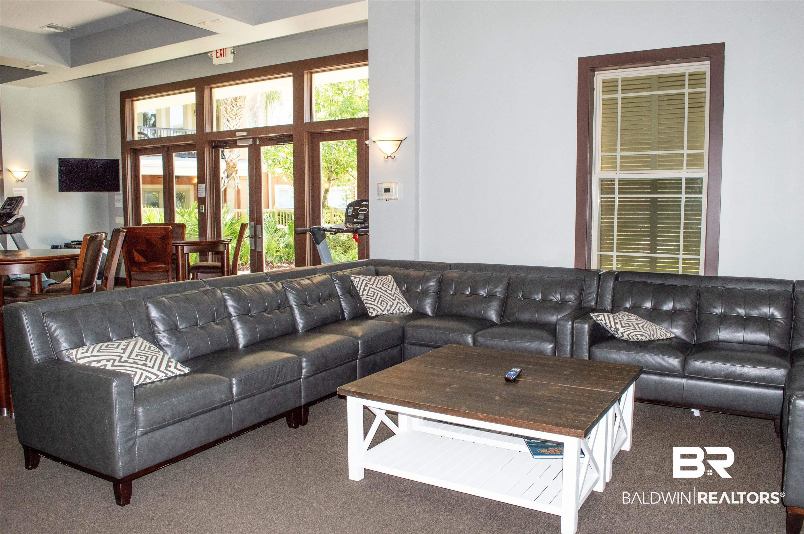 1430 Regency Road, Unit 301C Gulf Shores, AL 36542 - Photo 3 of 22 Lounge featuring a healthy amount of sunlight, french doors, and carpet floors