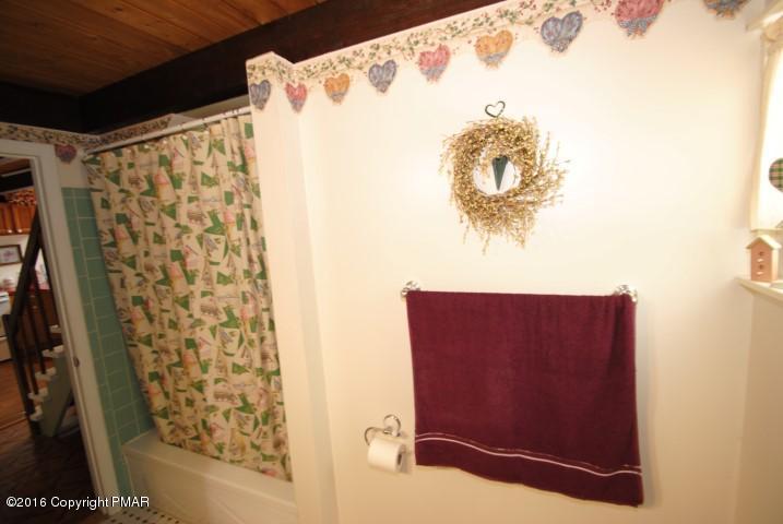 90 Highridge Road Albrightsville, PA 18210 - Photo 13 of 30 a bathroom with a shower curtain and a sink