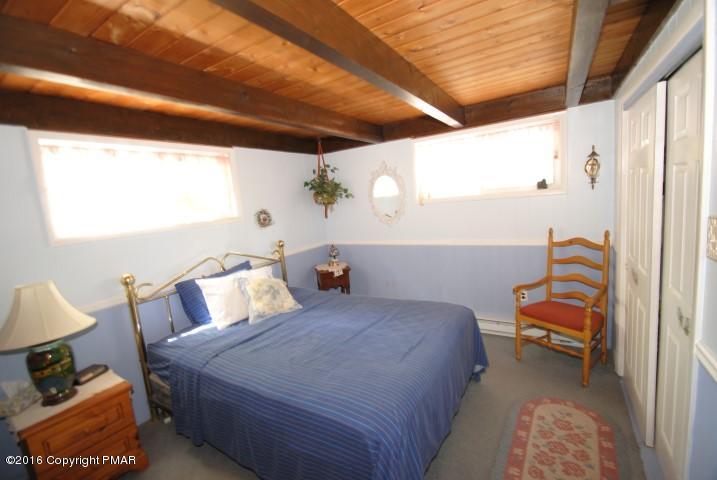 90 Highridge Road Albrightsville, PA 18210 - Photo 14 of 30 a bedroom with a bed and a window