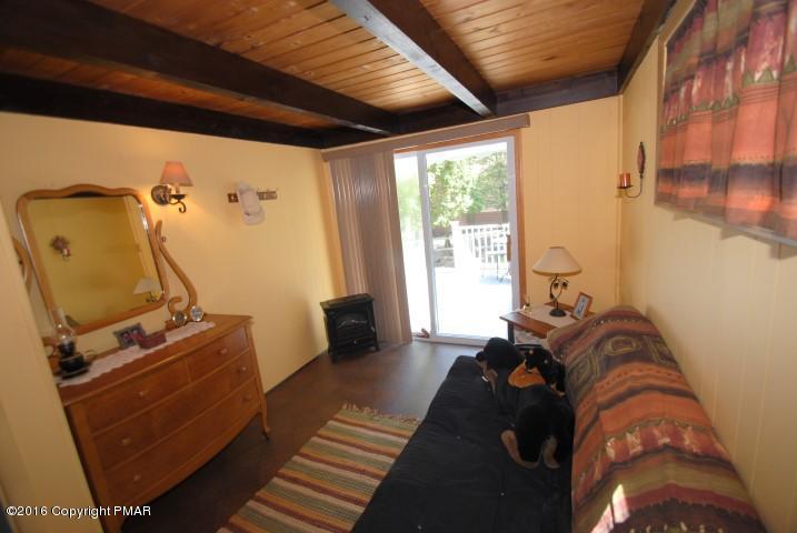90 Highridge Road Albrightsville, PA 18210 - Photo 17 of 30 a bed sitting in a bedroom next to a window